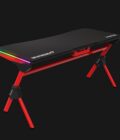 DAEDALUS M1 is an RGB gaming desk that features a mouse mat-covered surface, an innovative structural design, and RGB streaming lights on both wings of the table to enhance your gaming experience. • Cable Management • Cup Holder / Headset Holder • Power Strip Holder • Steel Frame Construction • Two RGB Light Strips • Waterproof Gaming Mouse Mat