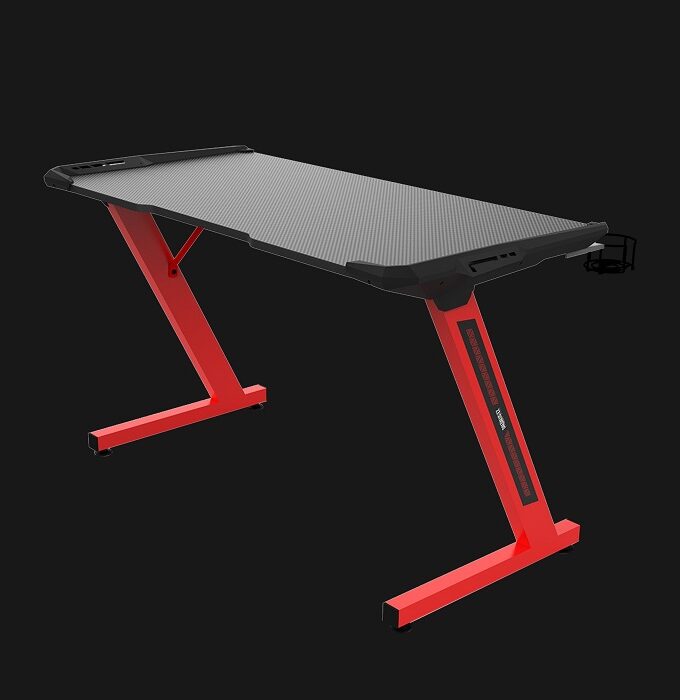 The next-gen gaming desk features a carbon fiber surface combining the concept of mousemat and desk into one layer; work and game on the smooth and responsive surface of DAEDALUS E2. • Carbon Fiber Surface • Cup Holder / Headset Holder • Steel Frame Construction