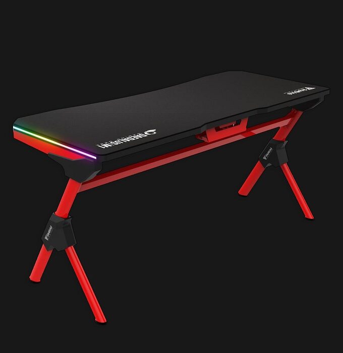 DAEDALUS M1 is an RGB gaming desk that features a mouse mat-covered surface, an innovative structural design, and RGB streaming lights on both wings of the table to enhance your gaming experience. • Cable Management • Cup Holder / Headset Holder • Power Strip Holder • Steel Frame Construction • Two RGB Light Strips • Waterproof Gaming Mouse Mat